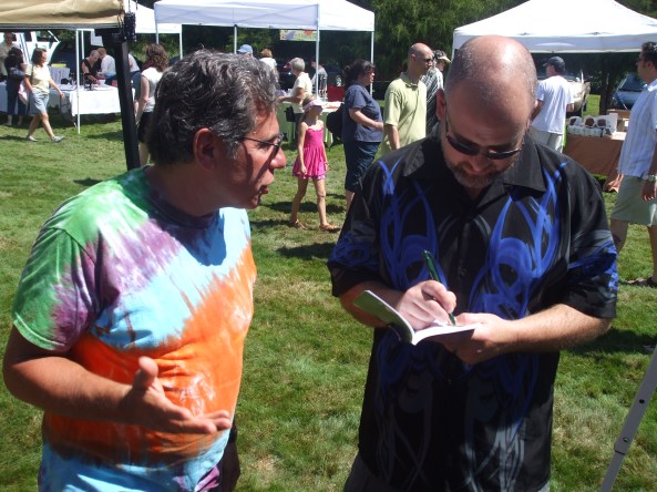 DSCF4151 Author David Price autographing his book for a fan. Photo by Jason Harris