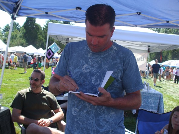 DSCF4152 Author Rob Watts autographing his novel, Huldufólk, for a fan. Photo by Jason Harris.