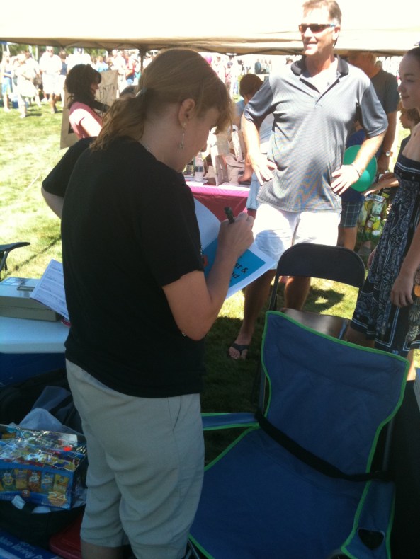 photo Author and NEHW Co-chair Stacey Longo signing a copy of Pookie and the Lost and Found Friend for a fan. Photo by Rob Watts.