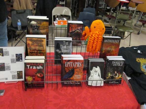 Books and a Cthulhu on the NEHW table. Photo by Jason Harris.