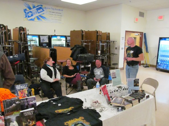 NEHW members hanging out behind the table. Photo by Jason Harris.