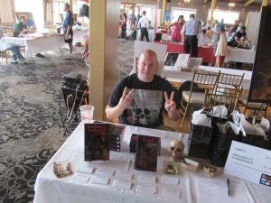 Author Vlad Vaslyn behind his table.