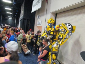 The Transformers' Bumblebee with some con attendees.