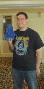 Cinema Knife FIght writer Barry Dejesu holding a Crocheted Cthulhus from the NEHW table. 