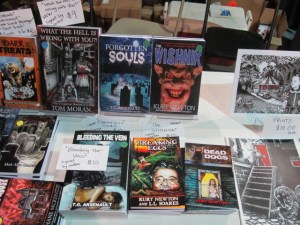 Books on the Sideshow Press table.