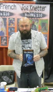 Author Joe Knetter holding Vile Beauty.