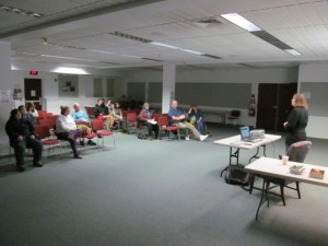 Stacey Longo talking to a crowd interested in writing.