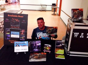 Author Rob Watts holding his latest book, Left-Hand Path. 