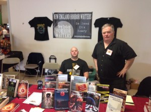 Authors Vlad Vaslyn and Dale T. Phillips behind the New England Horror Writers table.