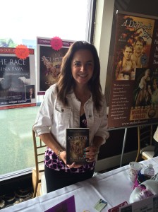 Author Gina Fava with her book, The Sculptor,