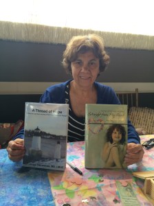 Author Jacqui DeLorenzo with her two books, A Thread of Hope and Straight from My Heart.