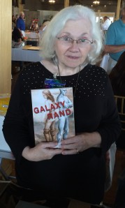 Author M. R. Tighe with her book, Galaxy Rand.
