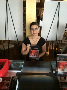 Author Katherine Silva with her book, Aequitas.