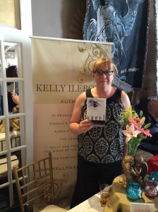 Author Kelly Ilebode with her book, Angel. 