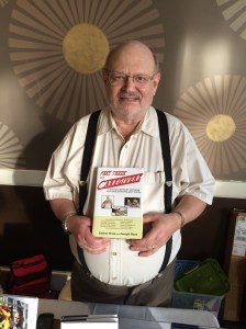 Author Joseph Ross holding his book, Fast Track for Caregivers.
