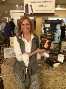 Author Connie Johnson Hambley with her book, The Charity.