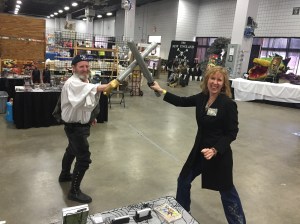 Author Stacey Longo dueling with one of the New England Brethren of Pirates.