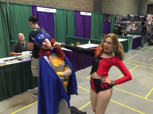 Harley Quinn punching Batgirl.