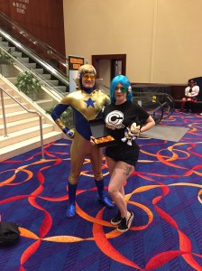 Booster Gold and a friend from the Capsule Corp.